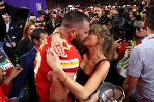 Travis Kelce and Taylor Swift sharing a kiss after Super Bowl 58