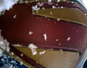 Snow on the Superman S shield, as a costume tease shared by James Gunn for his Superman movie