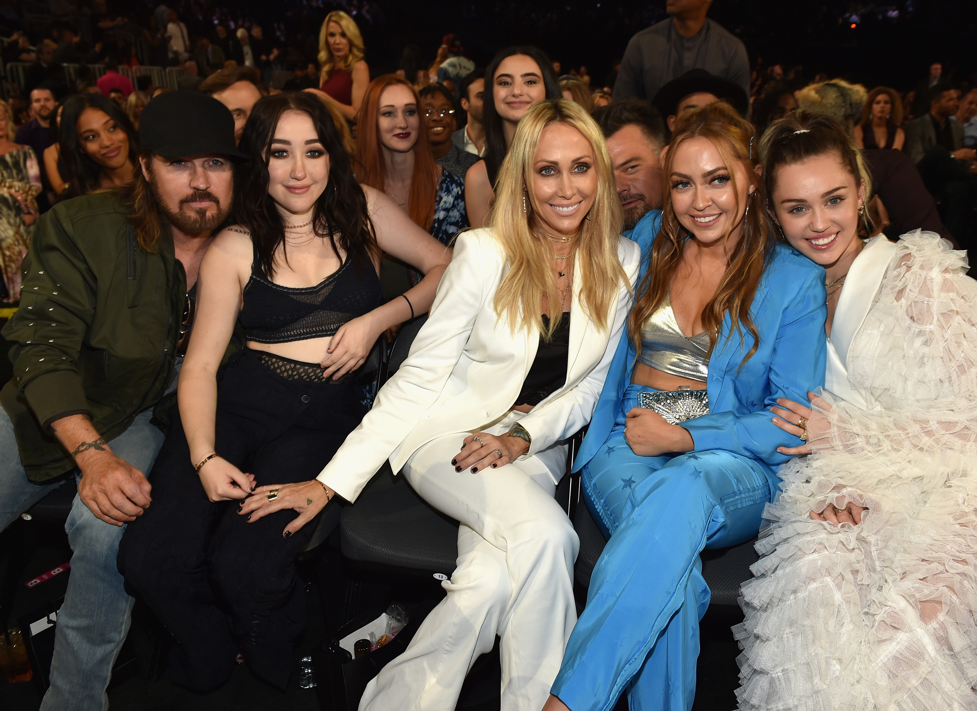 Tish and Noah are seen here in 2017 with Tish's ex-husband Billy Ray Cyrus along with Miley and sister Brandi
