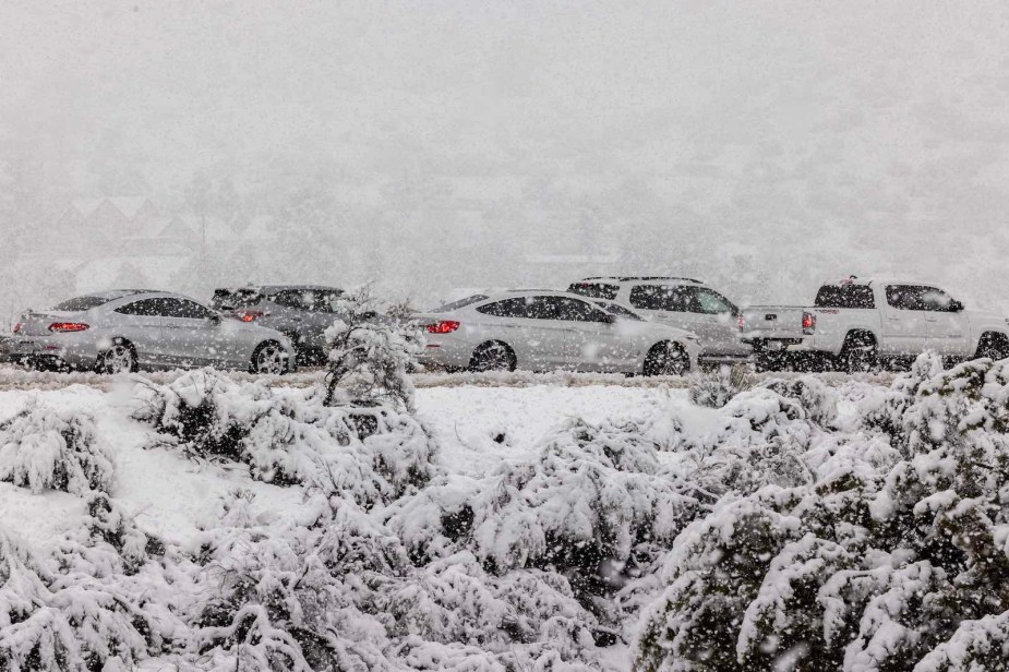 Cars stuck in a traffic jam during a snow storm.