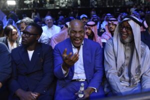 Mike Tyson, center, attends a boxing match between Jake Paul and Tommy Fury in Saudi Arabia.