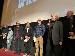 Producer Vibeke Vogel (with microphone) at the world premiere of 'Life and Other Problems' at CPH:DOX. To her left is co-producer John Archer.