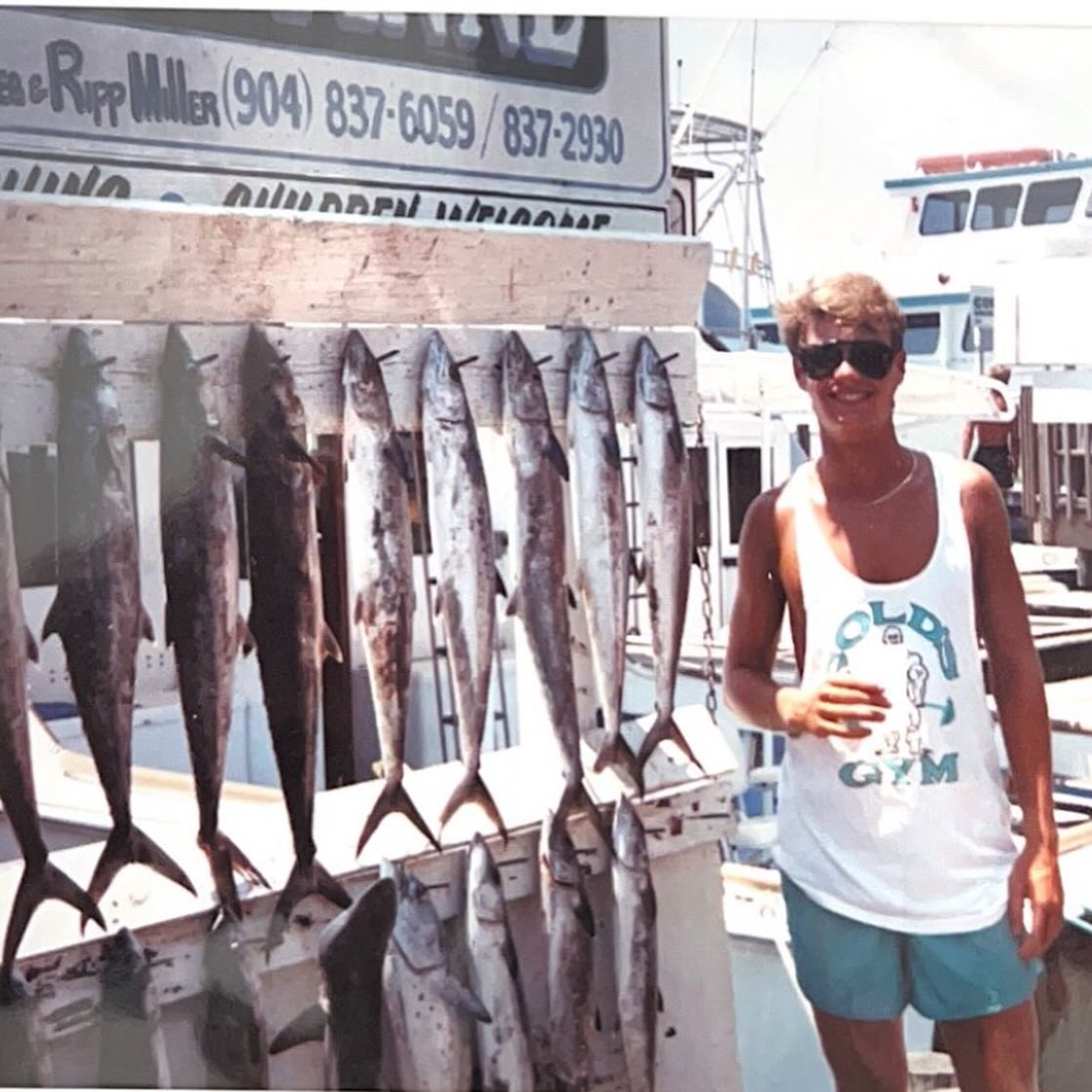 The throwback picture featured Ryan standing next to fish with a fresh tan and an oversized tank top