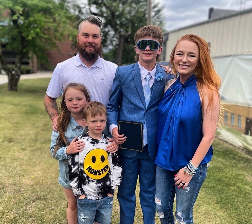 Maci and Taylor posed with their children