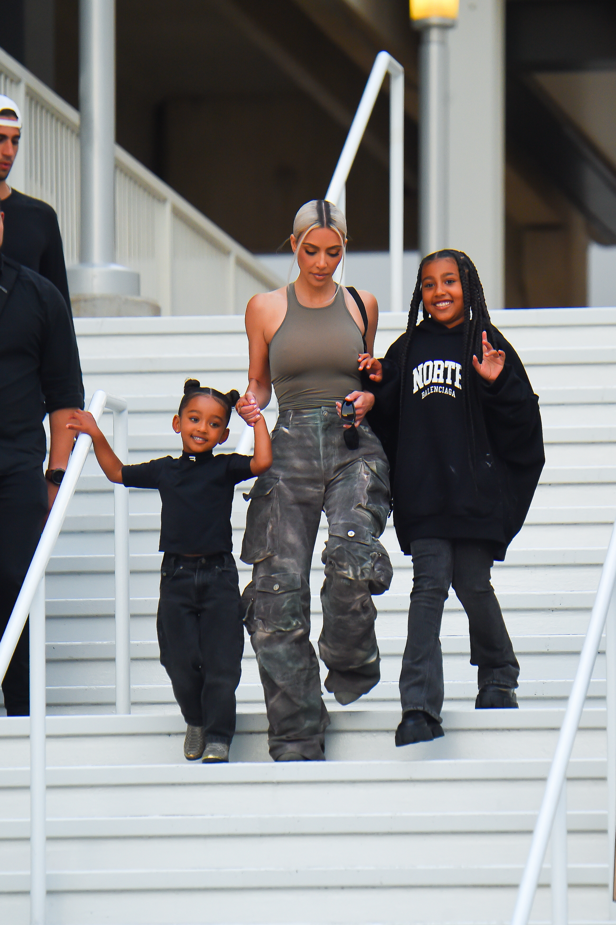 Kim Kardashian pictured with her kids North and Chicago West at an event in July 2022