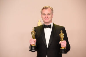 Christopher Nolan poses backstage with the Oscars for 'Directing' and 'Best Picture' during the live ABC telecast of the 96th Oscars