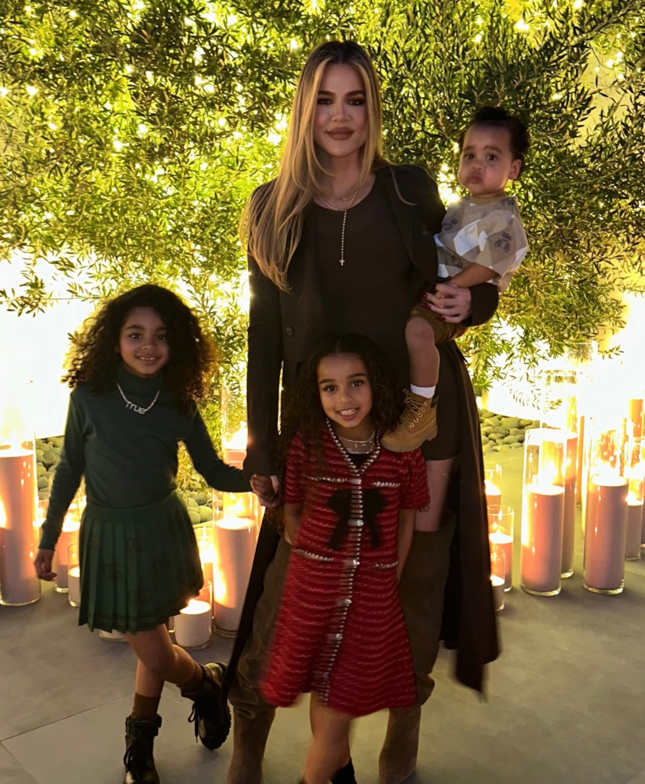 Khloe posed with her kids True and Tatum and Rob's daughter Dream (center)
