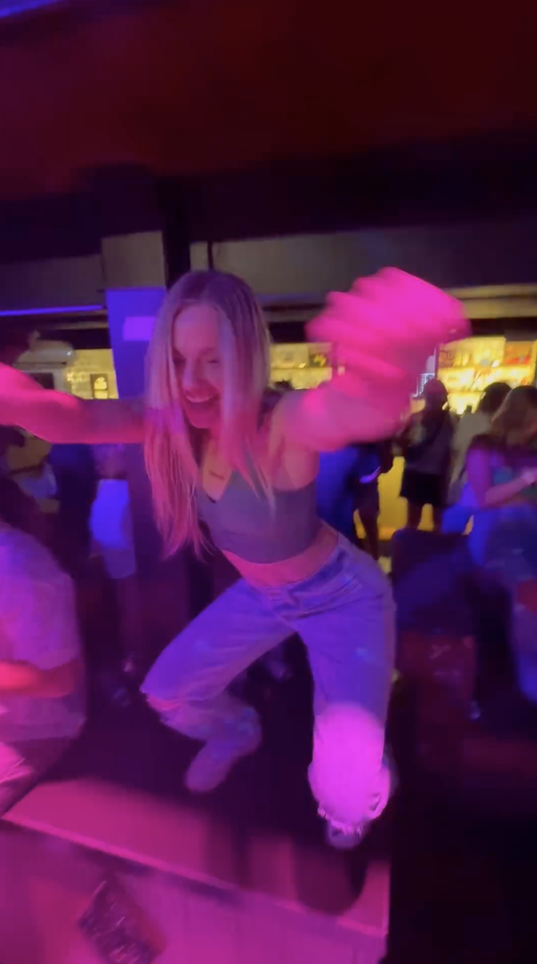 The MTV star waved her arms and showed off her gymnast athleticism as she dropped it low inside the crowded nightclub