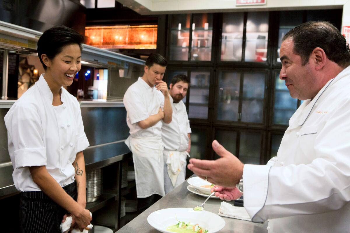 Veteran chef Emeril Lagasse with three contestant chefs on "Top Chef"