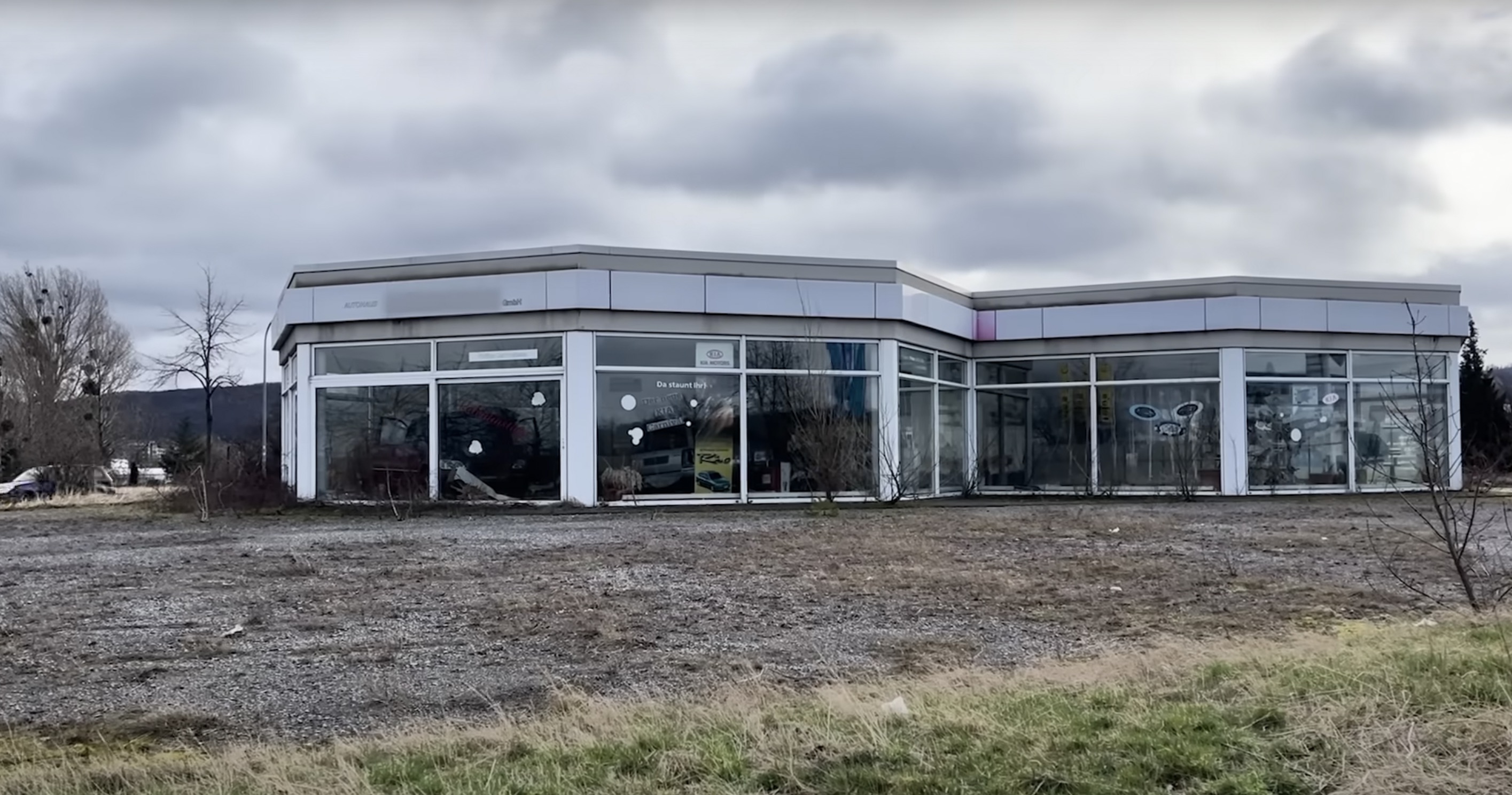There were abandoned cars in both the dealership's showroom as well as numerous workshops