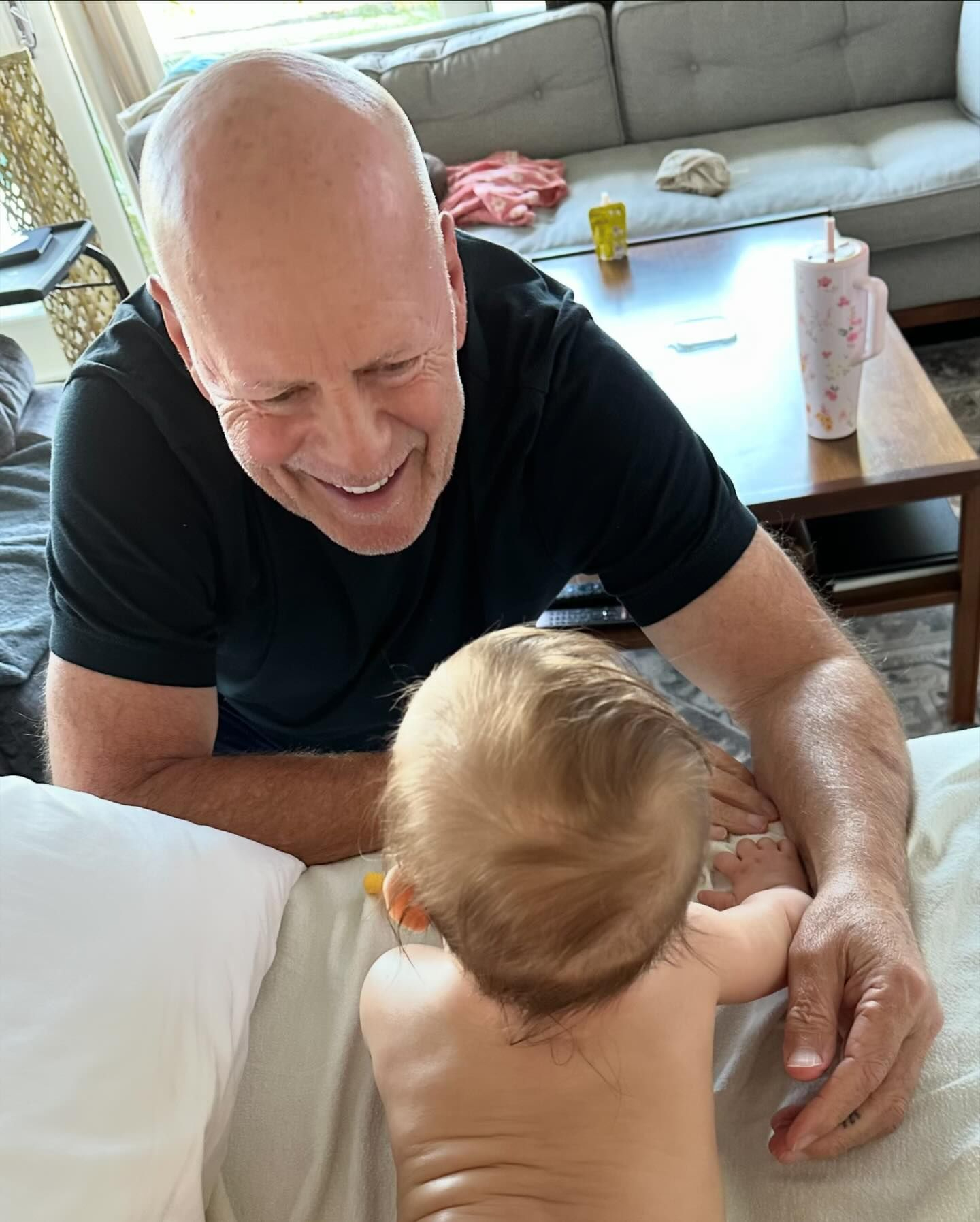 She also shared a picture of Bruce with their granddaughter