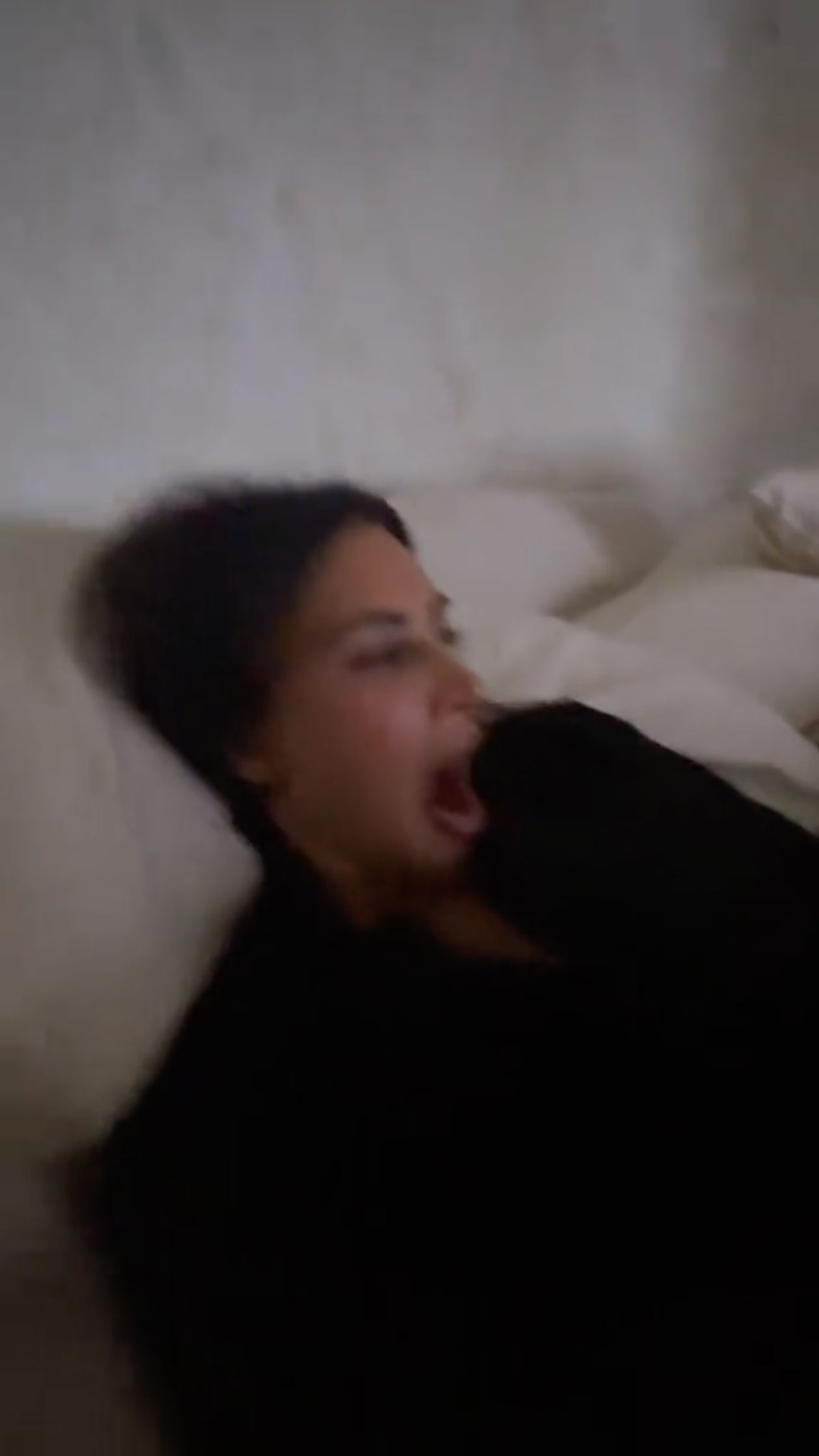 This time Kim was caught while yawning in bed