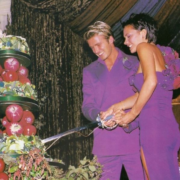 The happy couple cutting their wedding cake in 1999