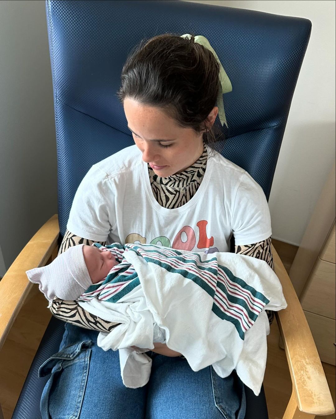 She shared a snap of her other daughter Carrie cradling the newborn