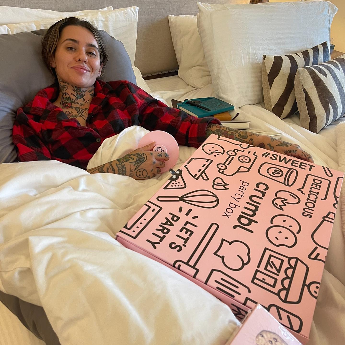 Another photo showed the singer smiling while resting in bed