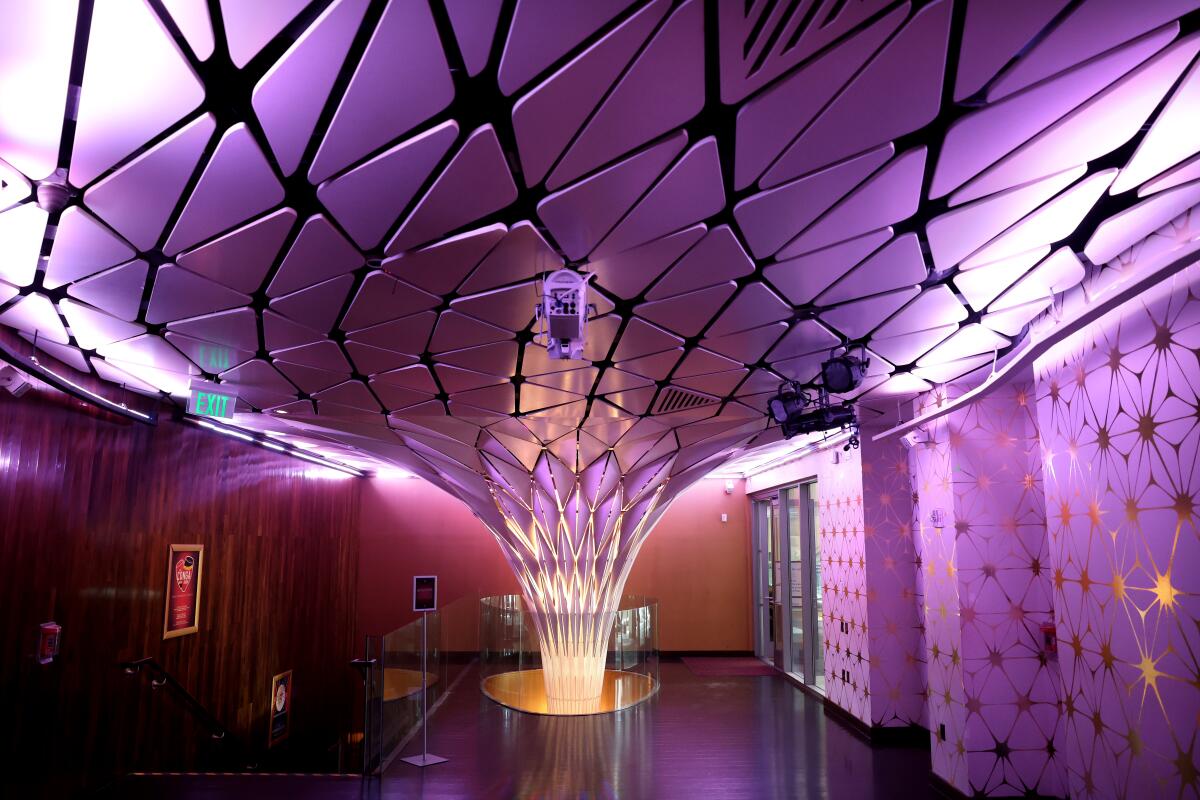 A faceted sculptural form glows as it rises through the floor at the Conga Room.