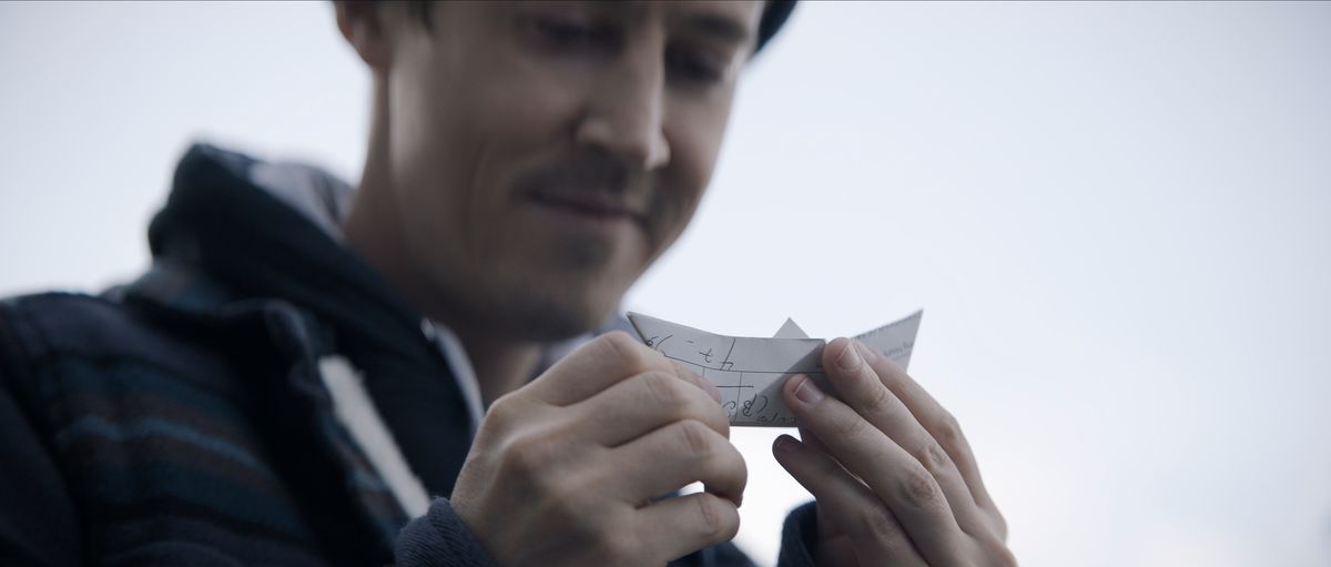 Alex Sharp as Will Downing holding a paper boat