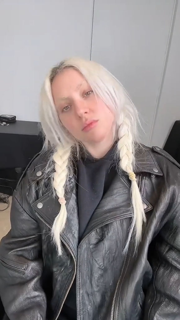 Gaga first appeared fresh-faced in the video, dressed casually, and sporting bleached eyebrows
