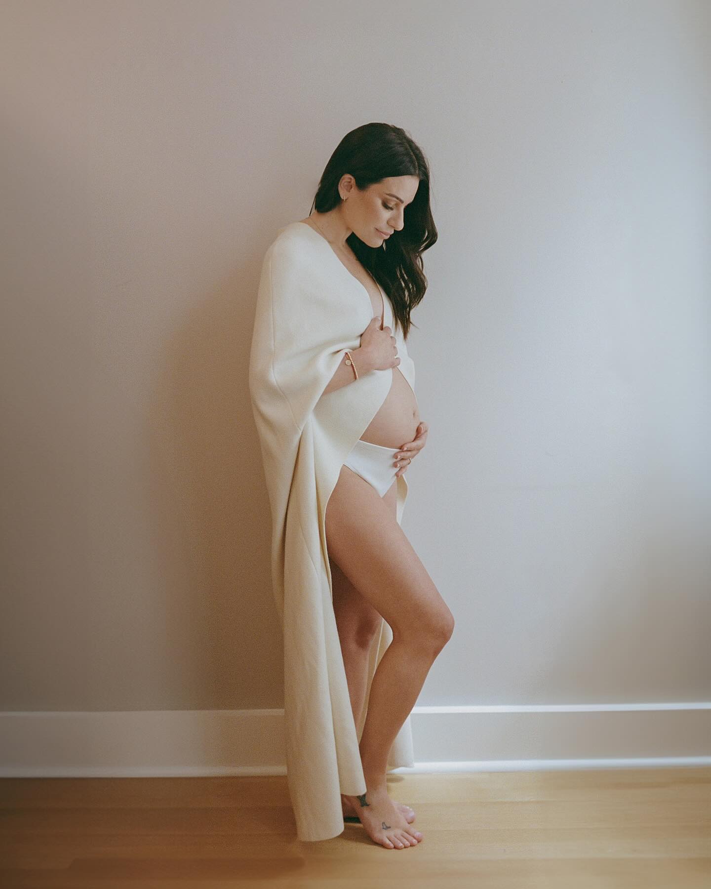 The intimate snapshots showed the Funny Girl star wearing a cream-colored shawl, that left her growing baby bump exposed, and matching underwear