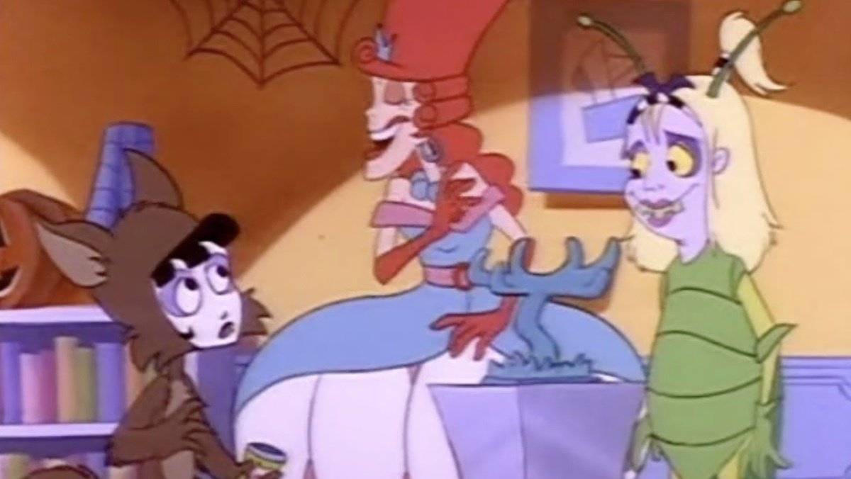 A still from the Beetlejuice cartoon with Lydia dressed as a werewolf, her mother as a Marie Antoinette, and Beetlejuice as girl dressed as a beetle for Halloween