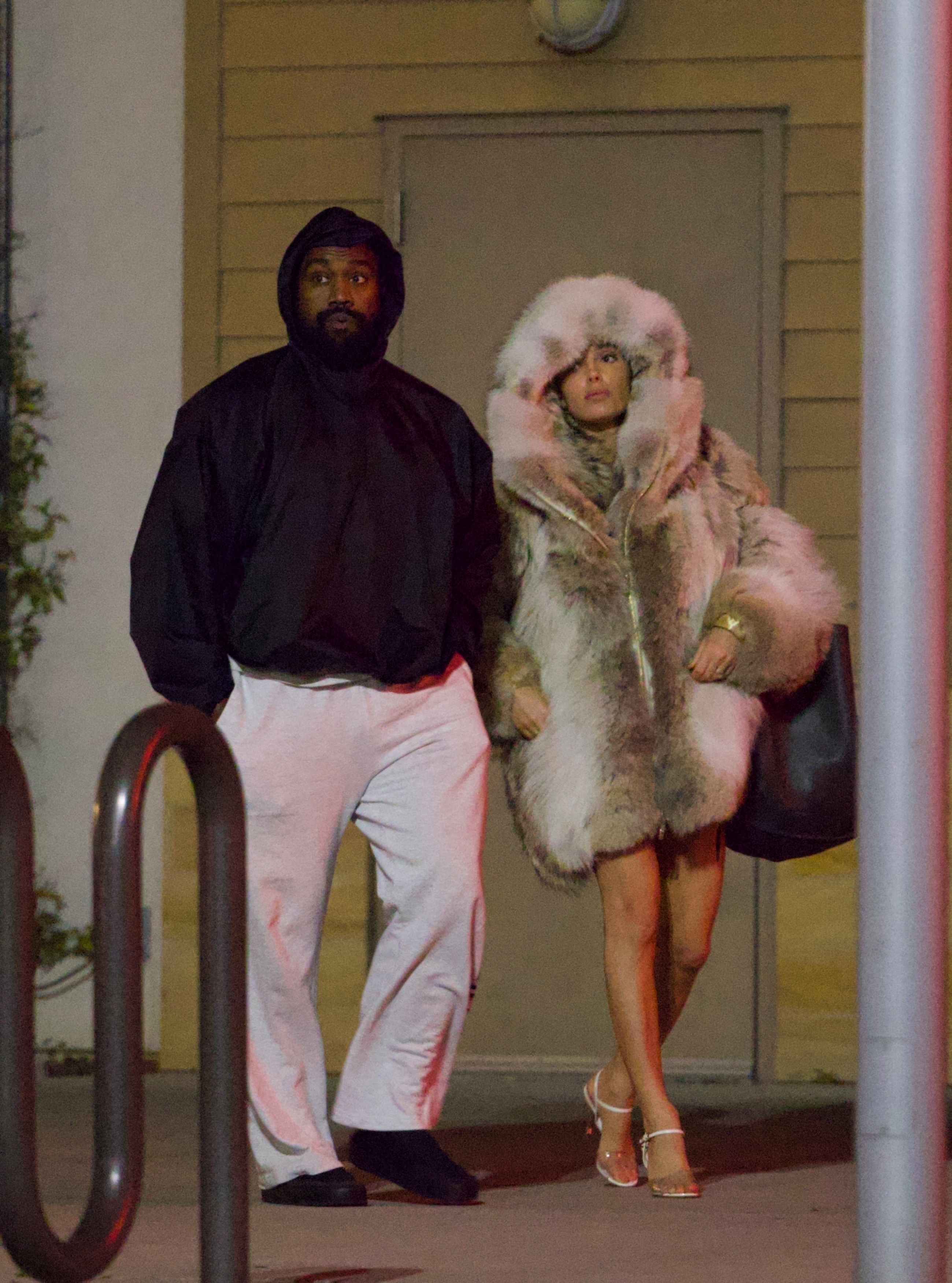 On Thursday, Bianca was seen wearing the gigantic fur coat - and not much else - as she departed a movie theater with Kanye