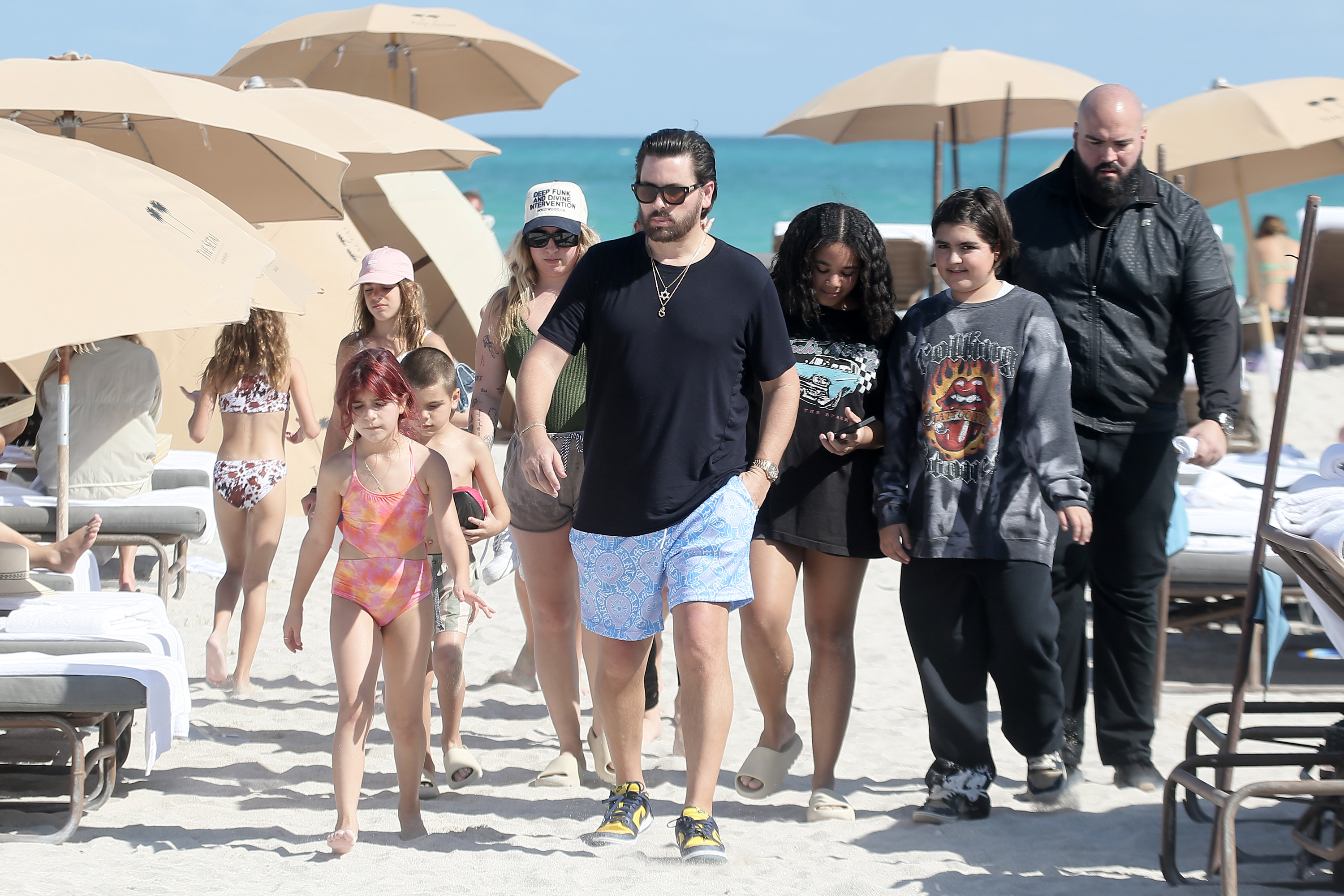 Scott seemed to have gained weight while out with his children on the beach in February 2022