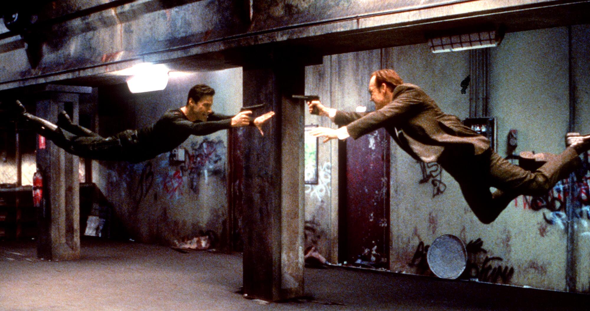 Neo (Keanu Reeves) and agent Smith (Hugo Weaving) face off in a "The Matrix"