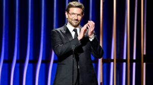 bradley cooper on stage accpeting an award