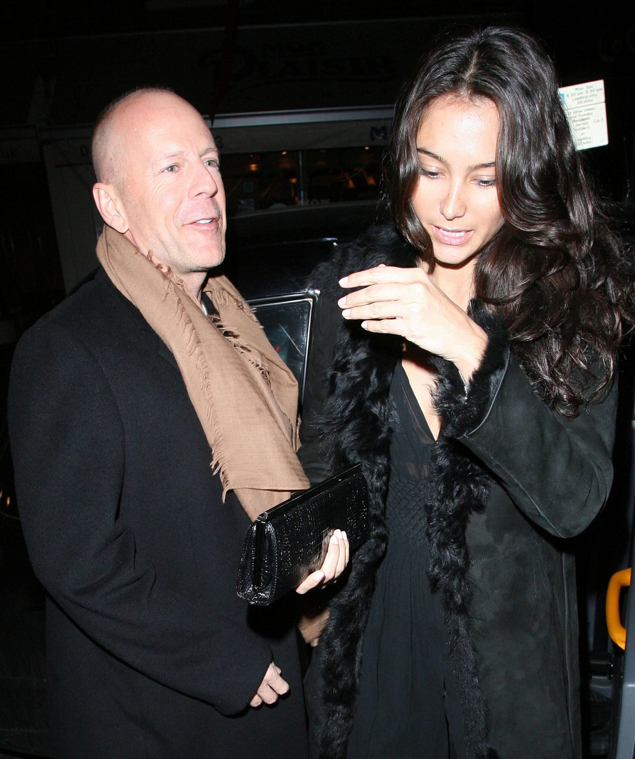 Bruce Willis and his new girlfriend Emma Heming arrive back at the Covent Garden Hotel in a black cab having had had dinner at The Ivy restaurant