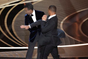 Will Smith (right) slaps Chris Rock on stage during the 94th Academy Awards