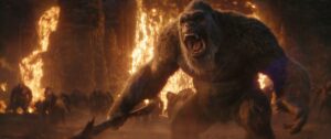 Kong bellows with his axe in a lava cavern of some kind in Godzilla x Kong: The New Empire