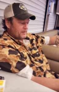 Gwen Stefani filmed her husband Blake Shelton as he opened a personalized gift from a fan while on his tour bus