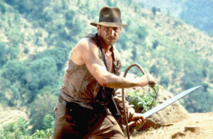 Harrison Ford has revealed he heard the Indiana Jones theme tune while waiting for a colonoscopy