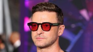 Justin Timberlake wearing red glasses