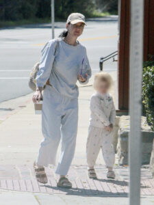 Photos captured Katy Perry hiding her rumored baby bump in a baggy sweat outfit during an outing with her daughter Daisy