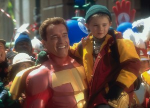 Actor Arnold Schwarzenegger with Jake Lloyd on the set of the film 'Jingle All the Way,' directed by Brian Levant