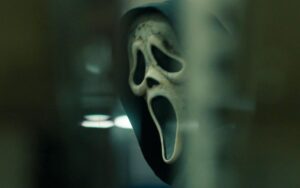 A blurry close-up image of Ghostface’s mask from Scream 6