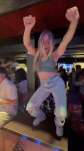 Mackenzie McKee flashed her abs in a tiny crop top while dancing on top of a bar during a wild girls' night out