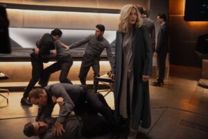Chaos erupts around Natascha McElhone as Dr. Halsey in the Halo TV show’s second season with UNSC crew members fighting each other after they’ve been infected by the Flood