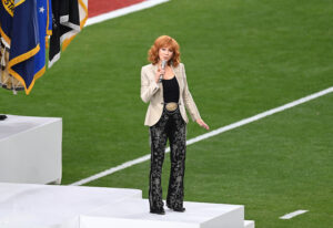 Reba McEntire shut down rumors that she confronted Taylor Swift at the Super Bowl for her behavior while Reba was singing the National Anthem