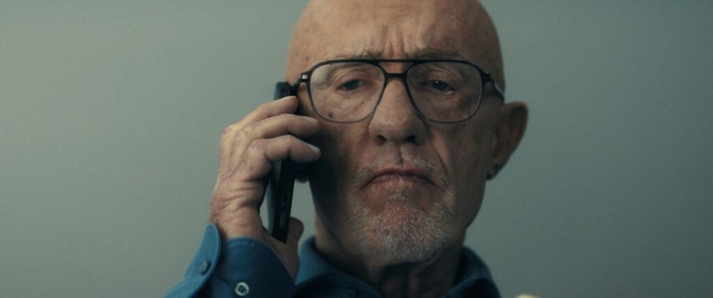 Jonathan Banks in a still from Constellation, looking tense on the phone