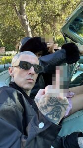 Alabama Barker shared a photo of her and her father Travis Barker making an NSFW gesture while in the car