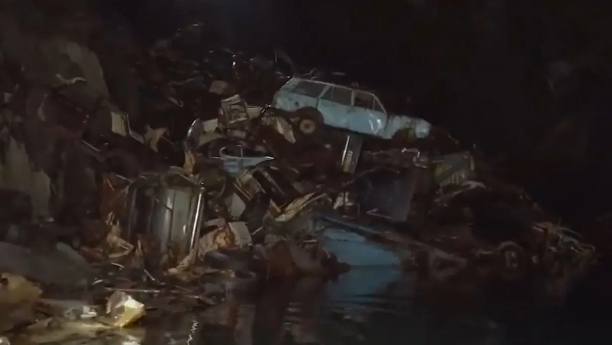 A closer shot of the giant car pile inside the cave