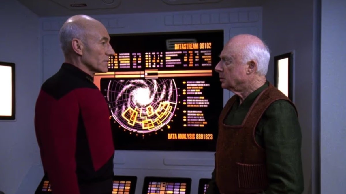 Captain Picard (Patrick Stewart) and Professor Galen (Norman Lloyd) argue on the Star Trek: Next Generation episode The Chase.