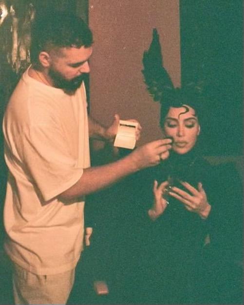Kim was shown in the middle of being transformed into a witch by the costume and makeup department