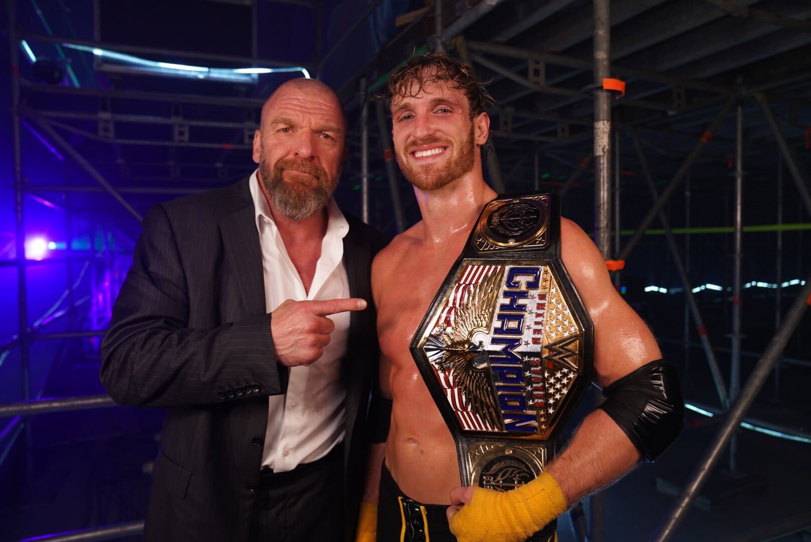 The star pictured with Triple H after winning the US Title