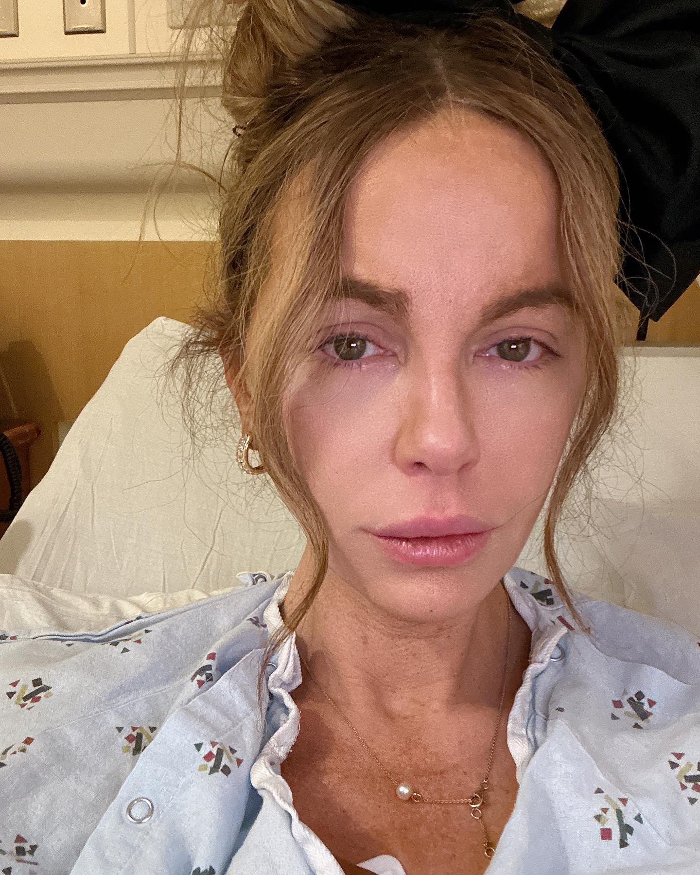Kate Beckinsale shared a tearful picture of herself in a hospital bed