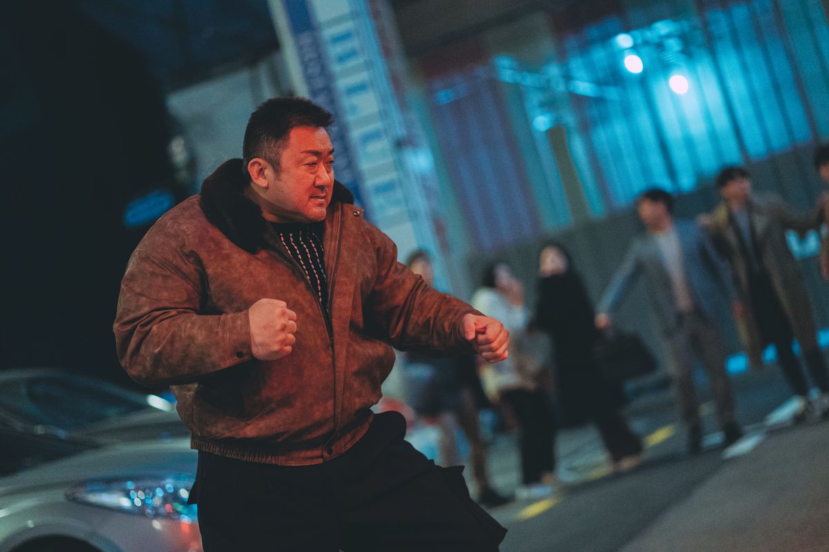 Ma Dong-seok poses after delivering a big punch in The Roundup: Punishment