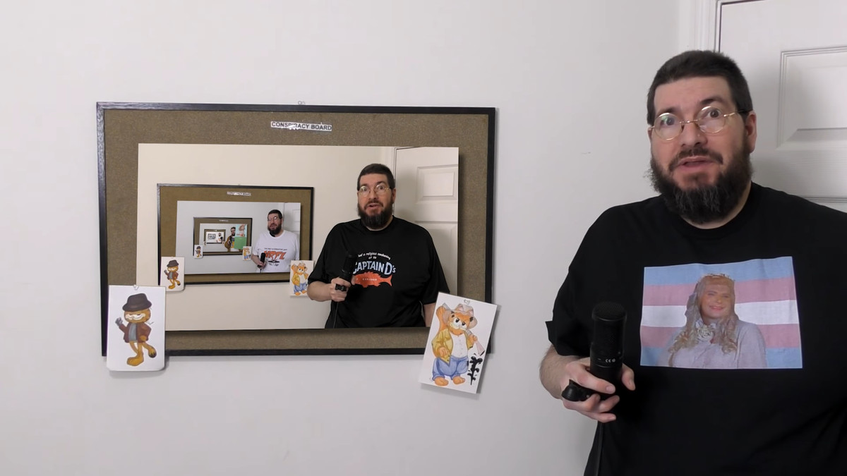 Russ Hoover standing in front of a frame that also has an image of Russ Hoover, who’s also standing in front of a frame with Russ Hoover.