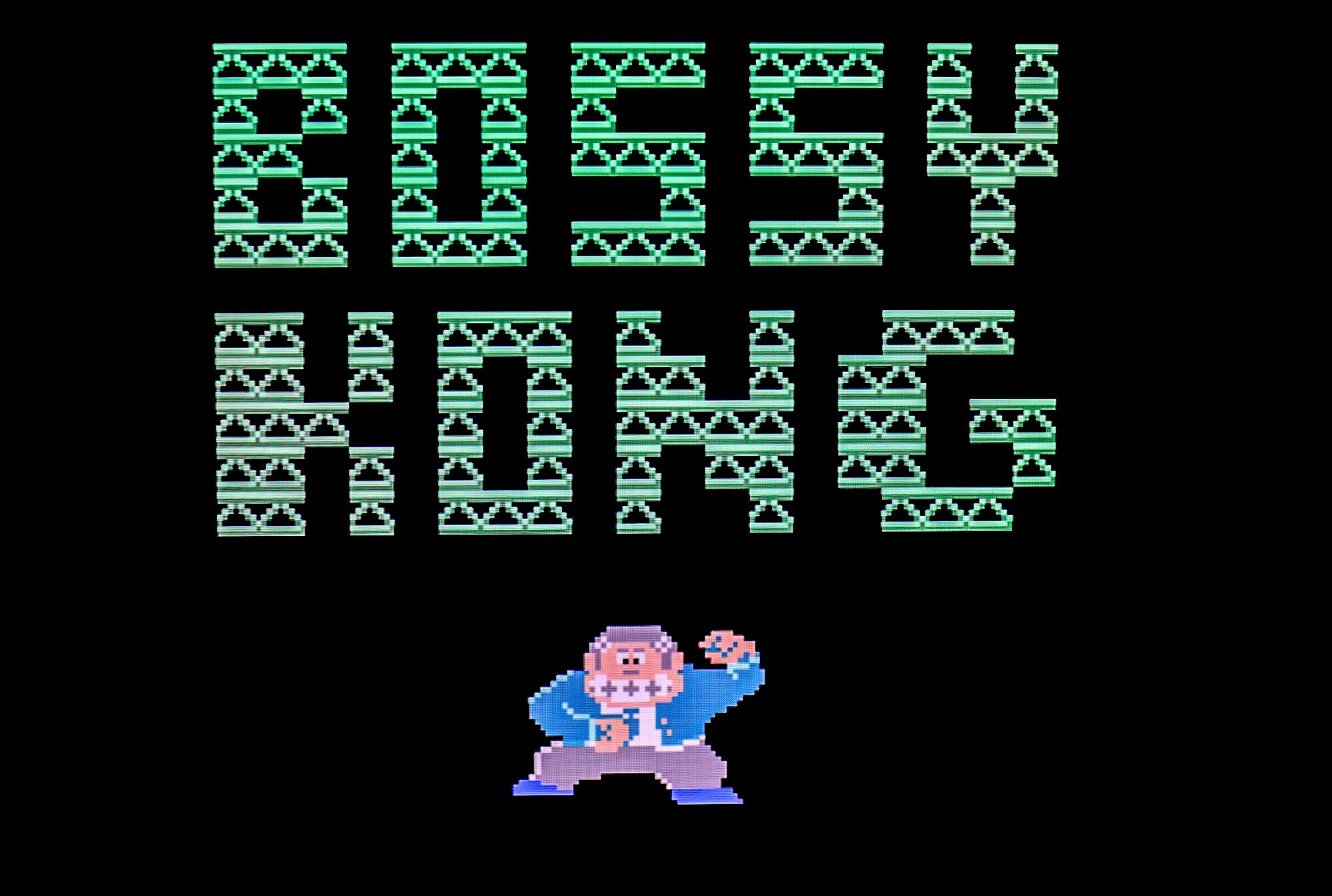 The title screen for "Bossy Kong," presented in all capital letters, and a small illustration of a monkey in a suit.